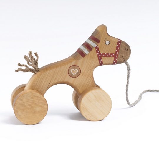 Wooden horse toy has a sensitive heart which helps him dream about a friend who would pull his sting. This handmade pull along toy is quality crafted and safe. 