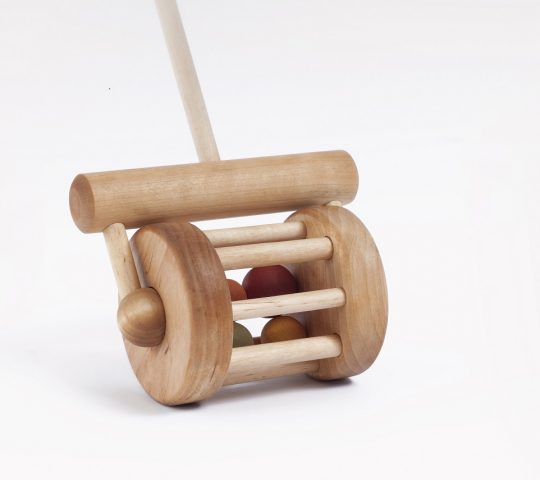The kids love pushing this handmade wooden toy rattle and listening to the sound he makes, because it has a bell and wooden balls inside him. 
